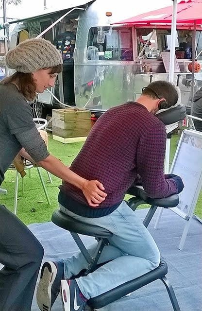 Rosie giving massage outside the Tube Diner at Bristol Paintworks