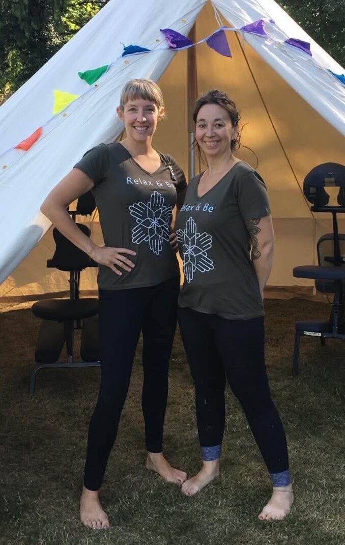 Relax and Be therapists at an outdoor event wearing early Relax and Be T-shirts